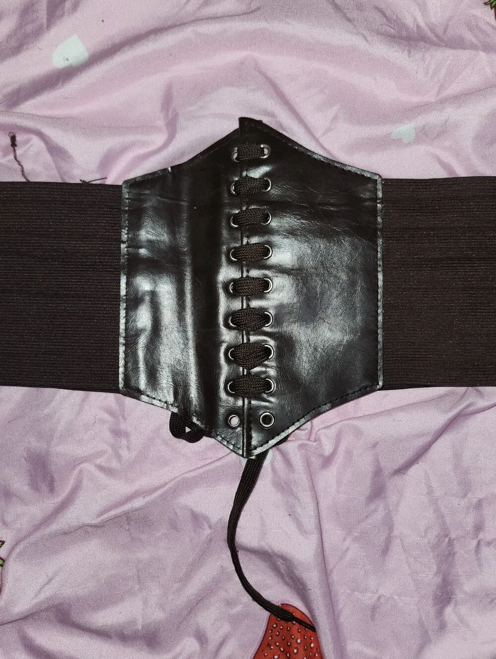 Brown faux leather corset belt with lace-up front and elastic